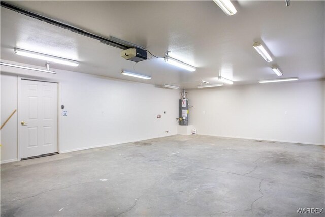 garage featuring a garage door opener and secured water heater