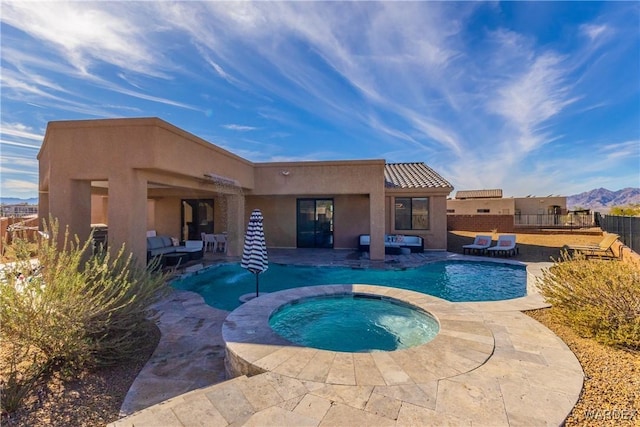 view of swimming pool featuring a fenced in pool, a patio, an in ground hot tub, fence, and a mountain view