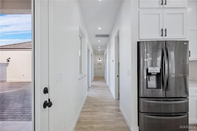 hallway featuring recessed lighting, visible vents, light wood-style flooring, and baseboards