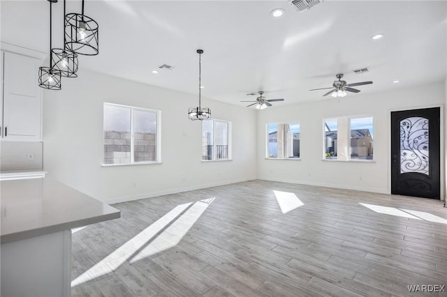 entrance foyer featuring light wood-style floors, baseboards, visible vents, and recessed lighting