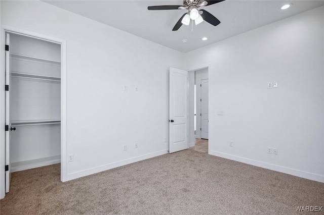 unfurnished bedroom with recessed lighting, baseboards, a closet, and light colored carpet