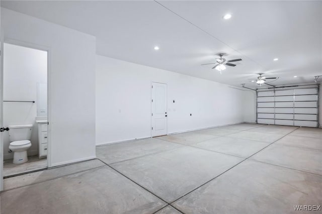 garage with baseboards and recessed lighting