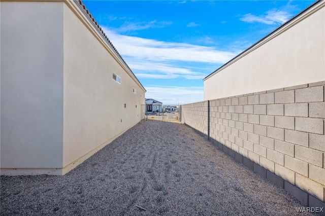 view of yard with fence and visible vents