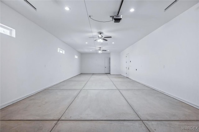 garage featuring recessed lighting and a garage door opener