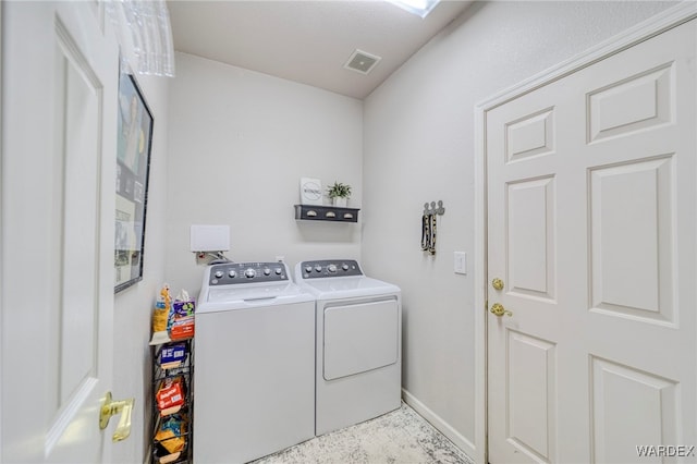 laundry area featuring laundry area, independent washer and dryer, visible vents, and baseboards