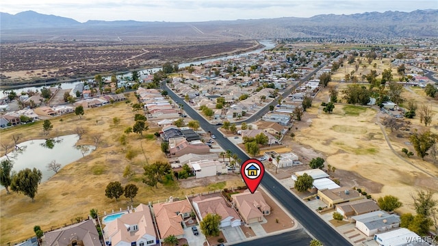 aerial view with a residential view and a water and mountain view