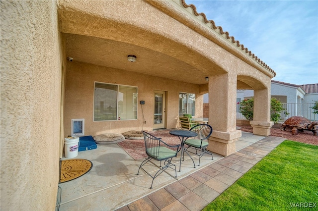 view of patio / terrace featuring fence