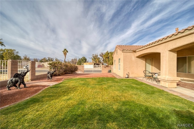 view of yard with a fenced backyard