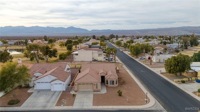 birds eye view of property with a mountain view and a residential view