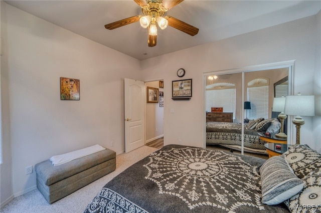 bedroom with light carpet, ceiling fan, and baseboards