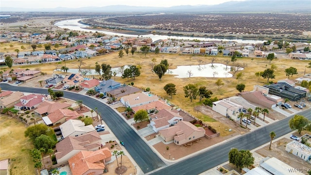 bird's eye view featuring a residential view and a water view