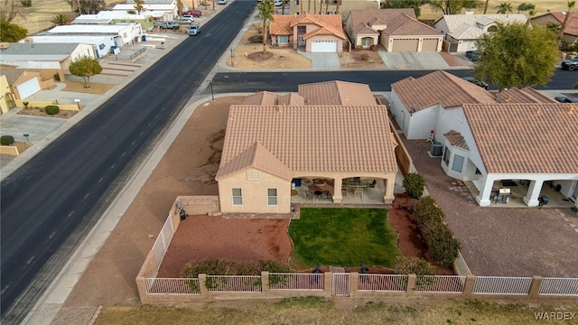 birds eye view of property with a residential view