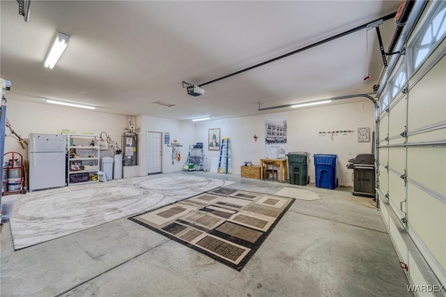 garage with a garage door opener, freestanding refrigerator, and secured water heater