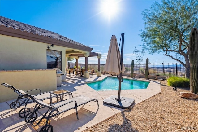 view of pool featuring a fenced in pool, a patio area, and fence