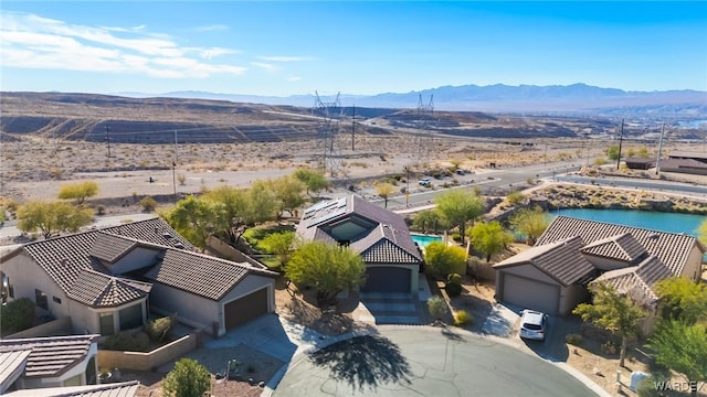 birds eye view of property with a mountain view