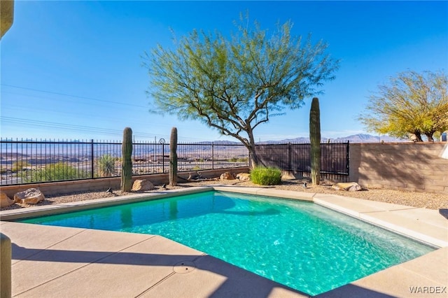 view of swimming pool featuring a fenced backyard and a fenced in pool