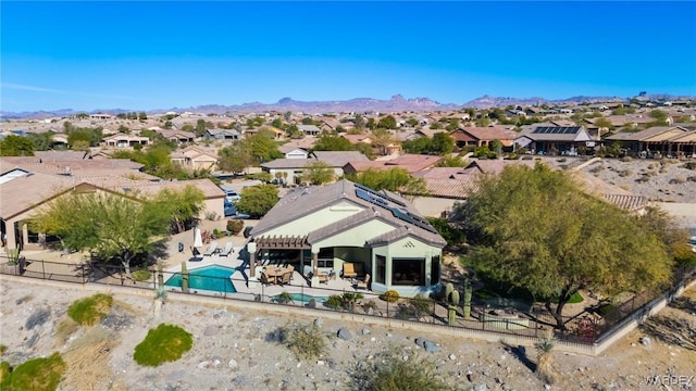 drone / aerial view featuring a residential view and a mountain view