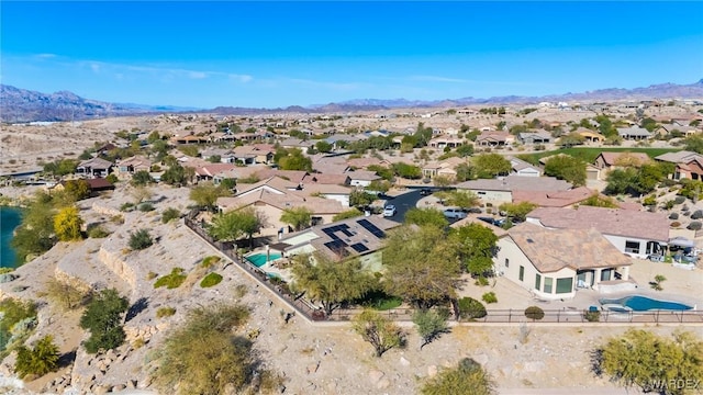 drone / aerial view featuring a residential view and a mountain view