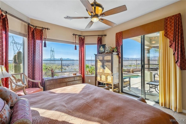 bedroom featuring ceiling fan and access to outside