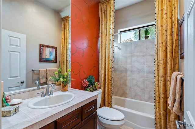 full bath featuring shower / bath combination with curtain, vanity, and toilet