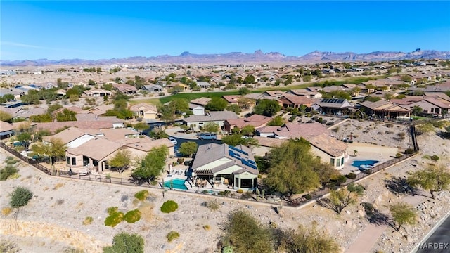 drone / aerial view featuring a residential view and a mountain view