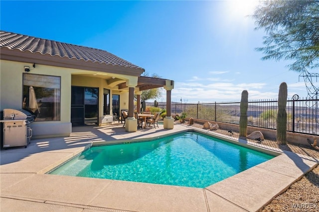 view of pool with a fenced in pool, a patio area, fence, and grilling area