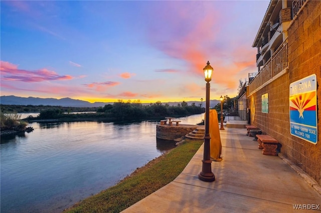 dock area with a water and mountain view