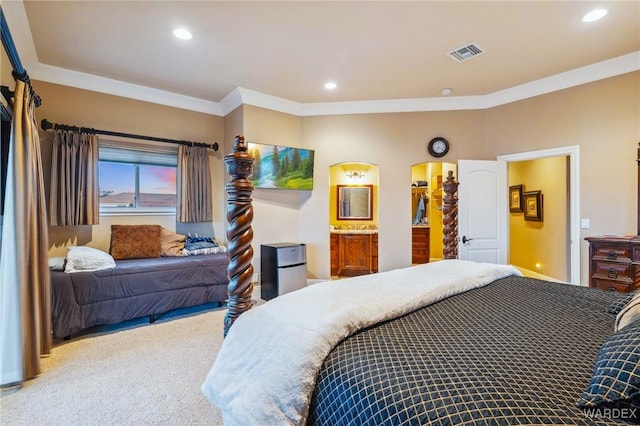 carpeted bedroom featuring ornamental molding, recessed lighting, and visible vents