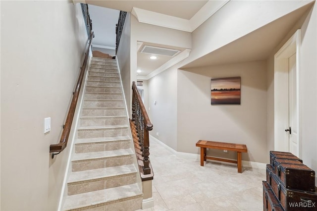 stairway with recessed lighting, crown molding, and baseboards