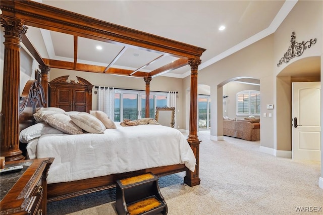 bedroom with baseboards, arched walkways, light colored carpet, crown molding, and recessed lighting