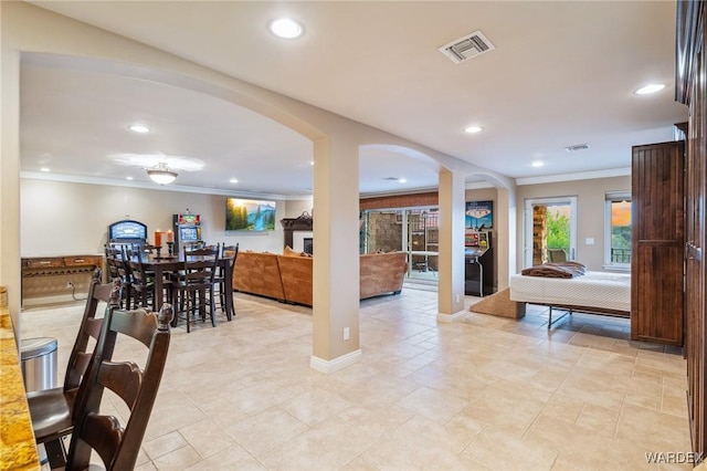 dining space featuring recessed lighting, visible vents, and crown molding