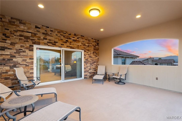 view of patio terrace at dusk