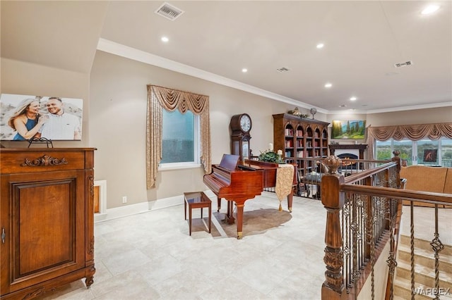 living area with a warm lit fireplace, recessed lighting, visible vents, baseboards, and ornamental molding