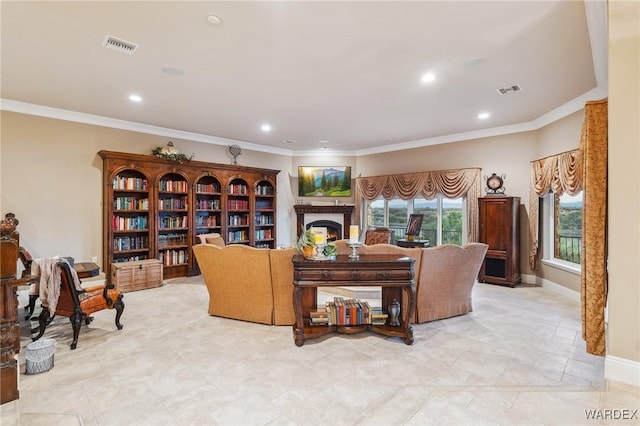 living room with a warm lit fireplace, baseboards, visible vents, and ornamental molding