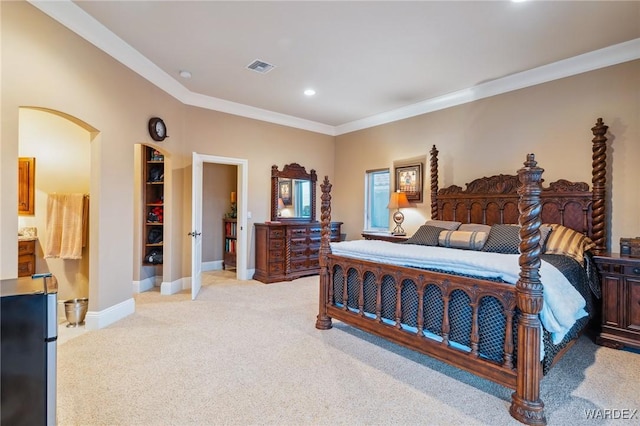 bedroom with light carpet, visible vents, arched walkways, baseboards, and crown molding