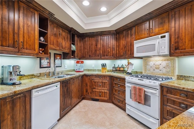 kitchen with white appliances, a raised ceiling, light stone counters, crown molding, and open shelves