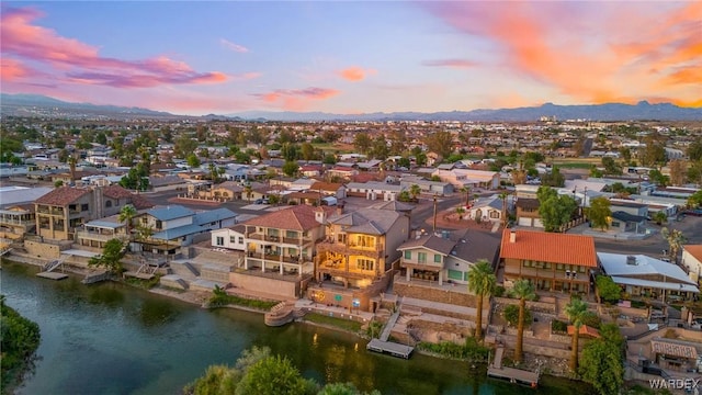 birds eye view of property with a residential view and a water and mountain view