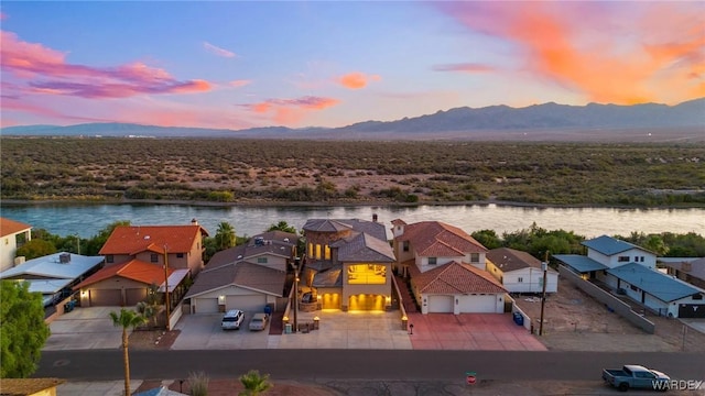 aerial view featuring a residential view and a water and mountain view