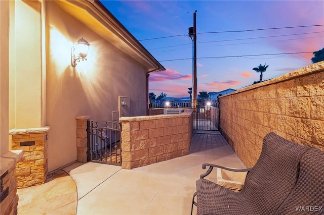 view of patio / terrace with a gate and fence