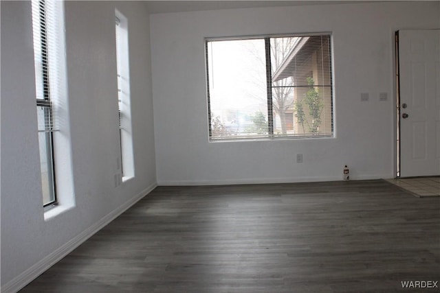 interior space featuring wood finished floors and baseboards