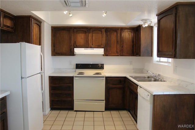 kitchen featuring visible vents, light tile patterned flooring, a sink, white appliances, and under cabinet range hood