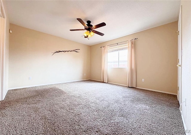 unfurnished room featuring carpet flooring, ceiling fan, a textured ceiling, and baseboards