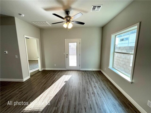 3371 N Apache St, Kingman, AZ 86401 - spare room with wood finished floors, a ceiling fan, baseboards, and a smoke detector