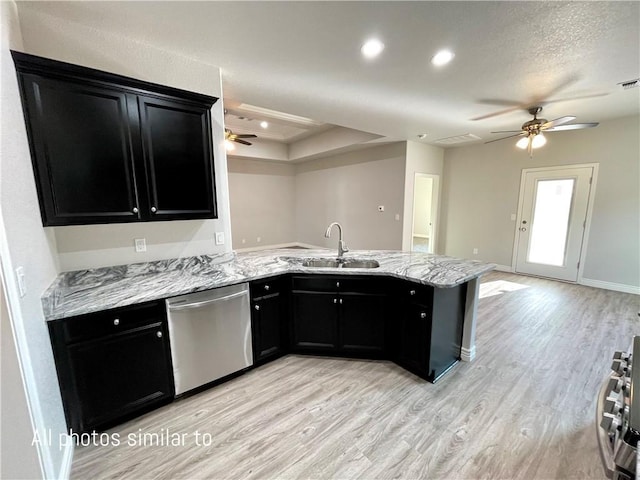 3371 N Apache St, Kingman, AZ 86401 - kitchen with stainless steel dishwasher, dark cabinetry, a ceiling fan, light wood-type flooring, and recessed lighting