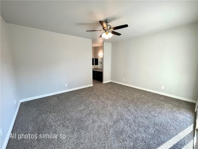 3371 N Apache St, Kingman, AZ 86401 - unfurnished room with dark colored carpet, a ceiling fan, and baseboards