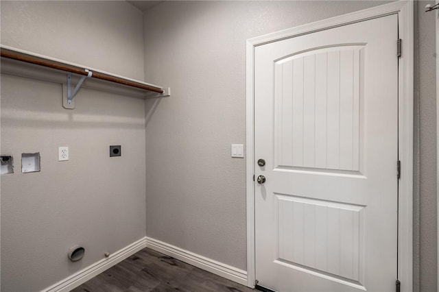 washroom with hookup for an electric dryer, dark wood finished floors, baseboards, and gas dryer hookup