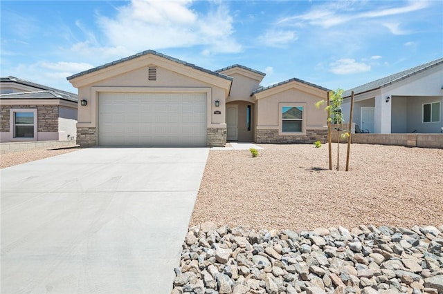 single story home featuring stone siding, concrete driveway, stucco siding, and a garage