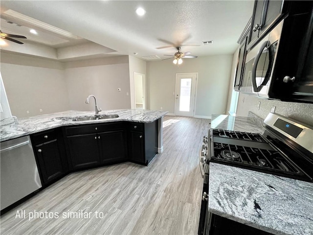 3371 N Apache St, Kingman, AZ 86401 - kitchen featuring ceiling fan, a sink, dark cabinets, appliances with stainless steel finishes, and recessed lighting