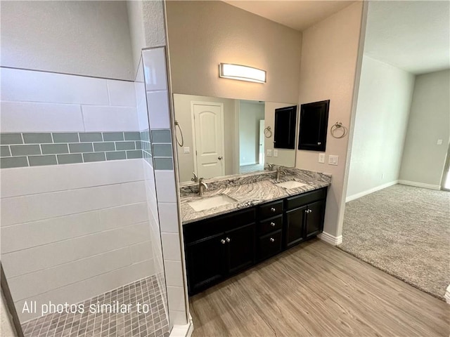 3371 N Apache St, Kingman, AZ 86401 - full bath featuring wood finished floors, double vanity, and baseboards