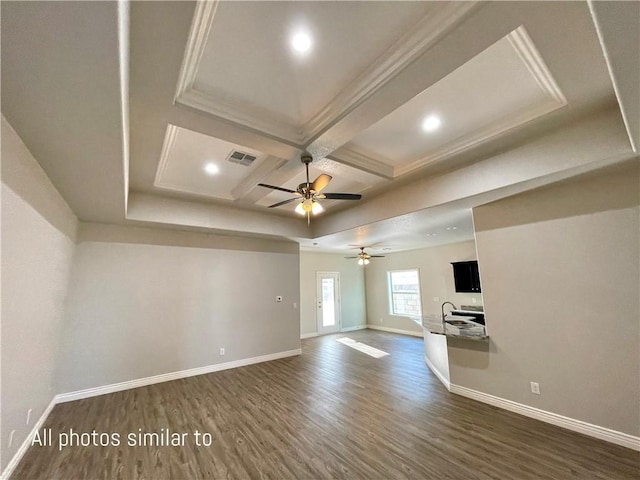 3371 N Apache St, Kingman, AZ 86401 - unfurnished room featuring dark wood-style flooring, baseboards, coffered ceiling, ceiling fan, and beam ceiling